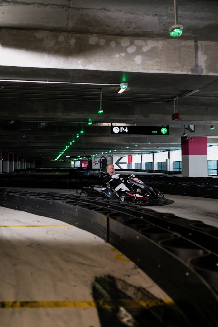 Thrilling indoor go-kart racing featuring a driver navigating sharp turns on a modern track.